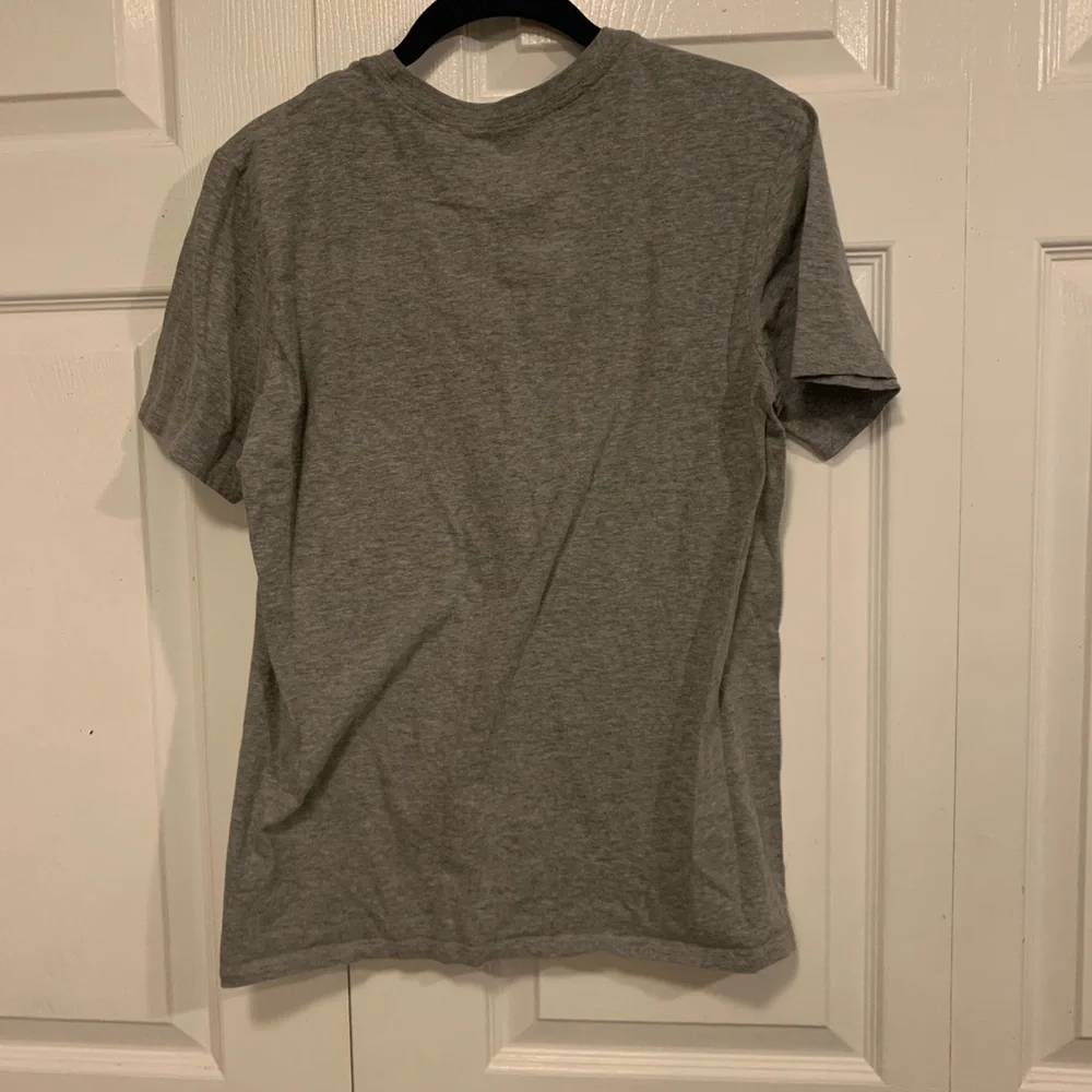Nike grey and white tee with Nike‎ symbol